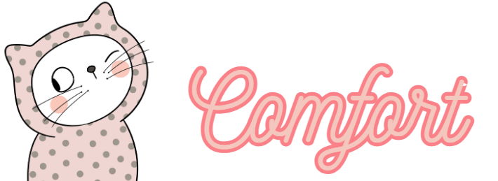 A white cat winking and wearing a pink spotted onesie with the word "comfort" next to the cat in pink joined-up handwriting