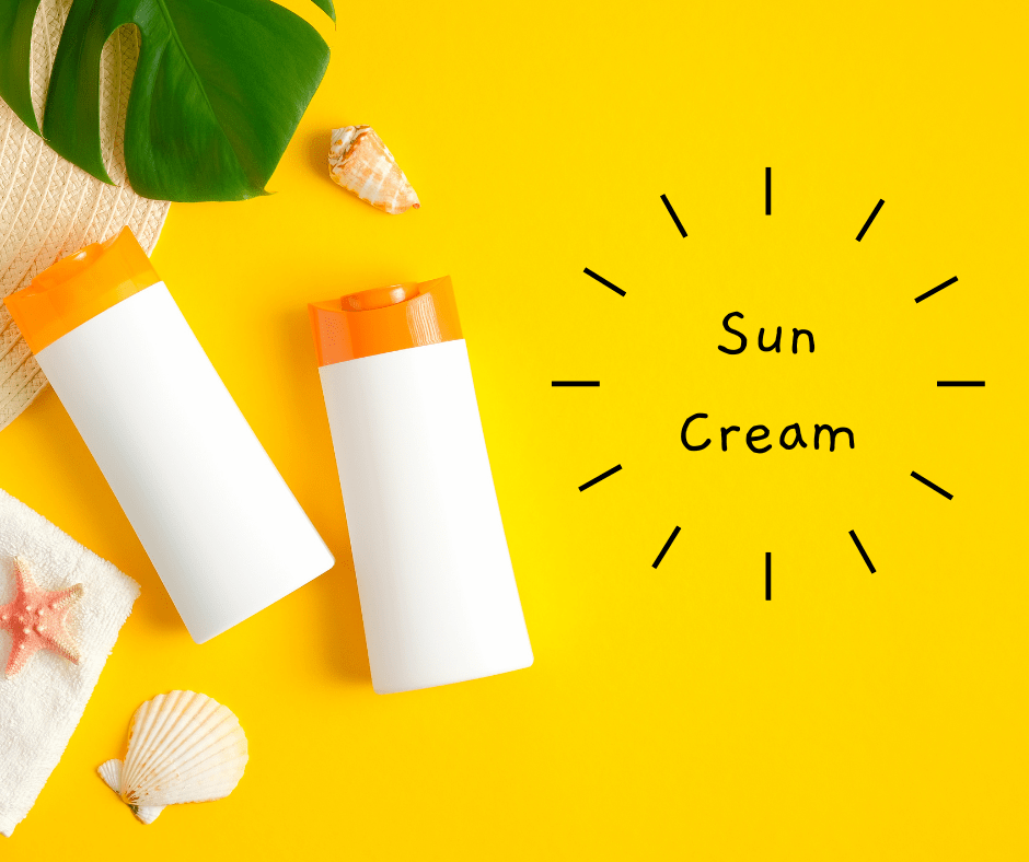 A yellow background with the words "Sun cream" in black. There are 2 bottles of sun cream with some shells and leaves